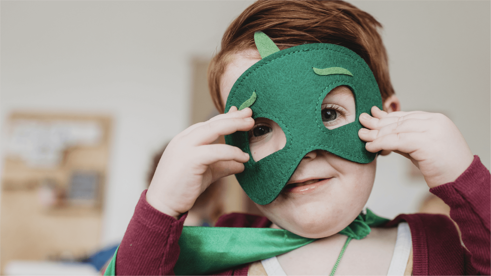 A child in dressing up clothes doing imaginative play